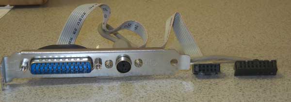 PS/2 female and DB25 male ports on a metal bracket,